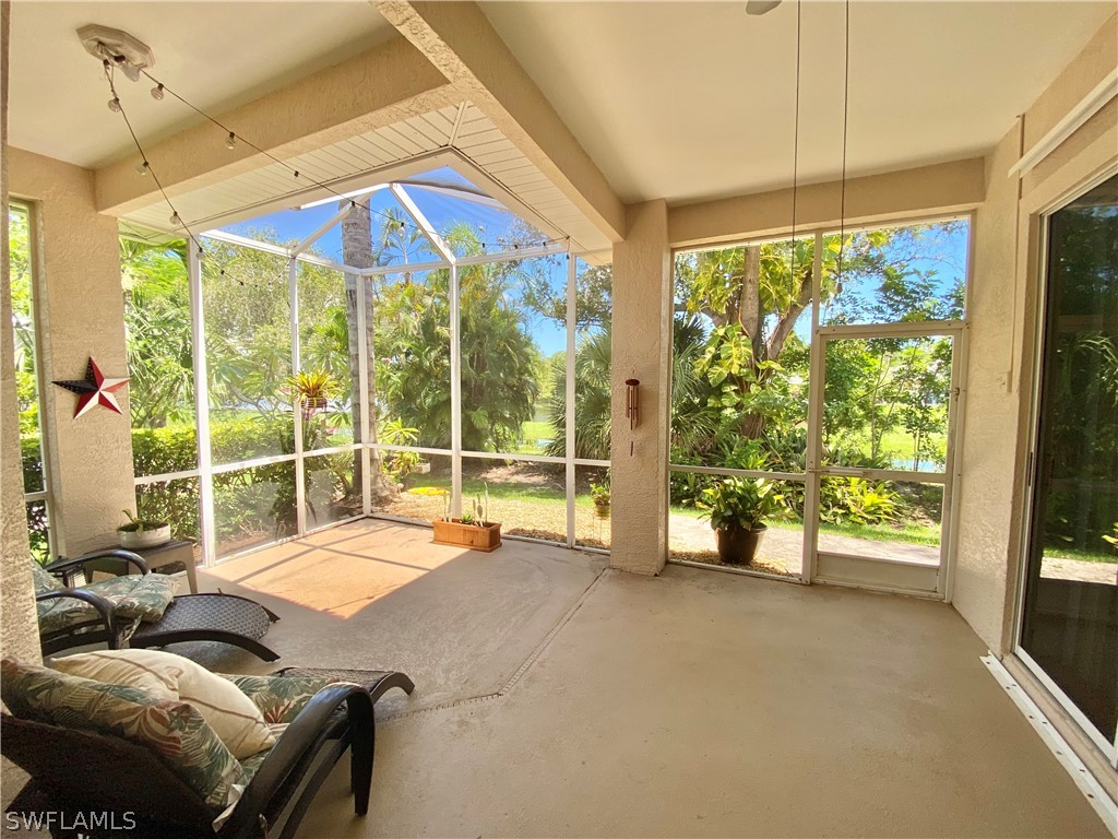9012 West Ridge Court Fort Myers, FL 33912 - Photo 2 of 23 a view of a livingroom with furniture and floor to ceiling window