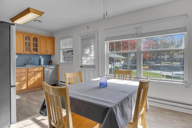 a view of a dining room with furniture window and outside view