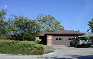 a view of a car in front of a house