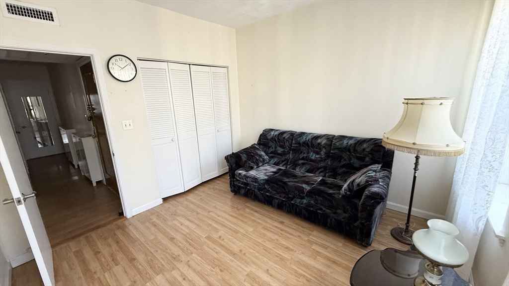 92 Gordon Street, Unit 301 Boston, MA 02135 - Photo 9 of 15 a living room with furniture