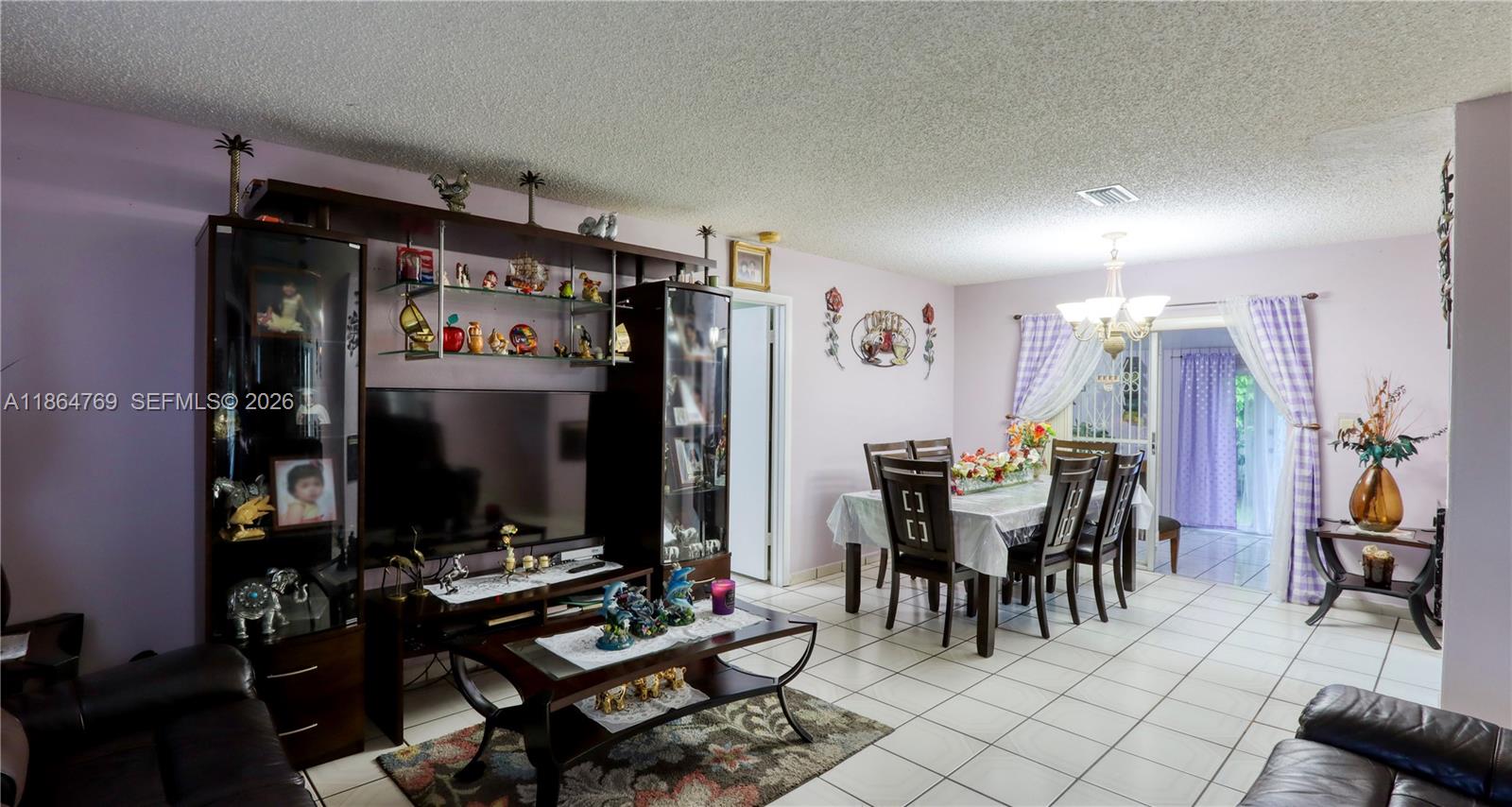 15825 Southwest 305th Terrace Homestead, FL 33033 - Photo 20 of 36 a view of a dining room with furniture