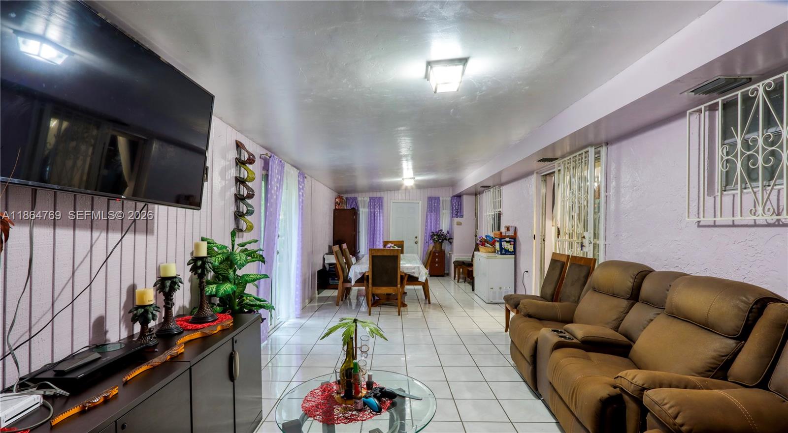 15825 Southwest 305th Terrace Homestead, FL 33033 - Photo 22 of 36 a living room with furniture and a potted plant