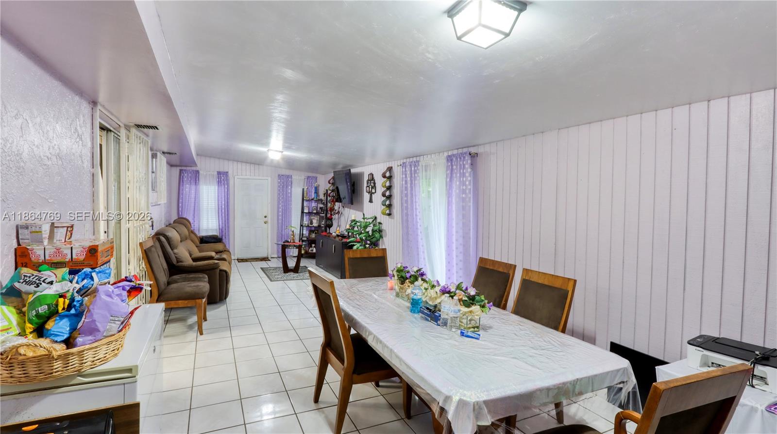 15825 Southwest 305th Terrace Homestead, FL 33033 - Photo 23 of 36 a view of a dining room with furniture