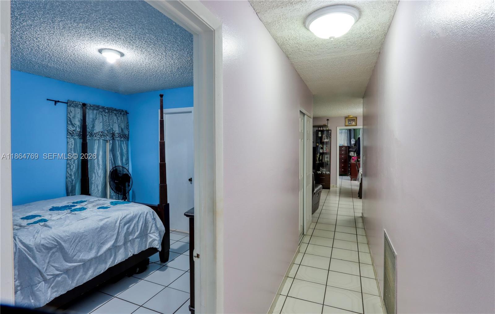 15825 Southwest 305th Terrace Homestead, FL 33033 - Photo 30 of 36 a bedroom with a bed and a walk in closet