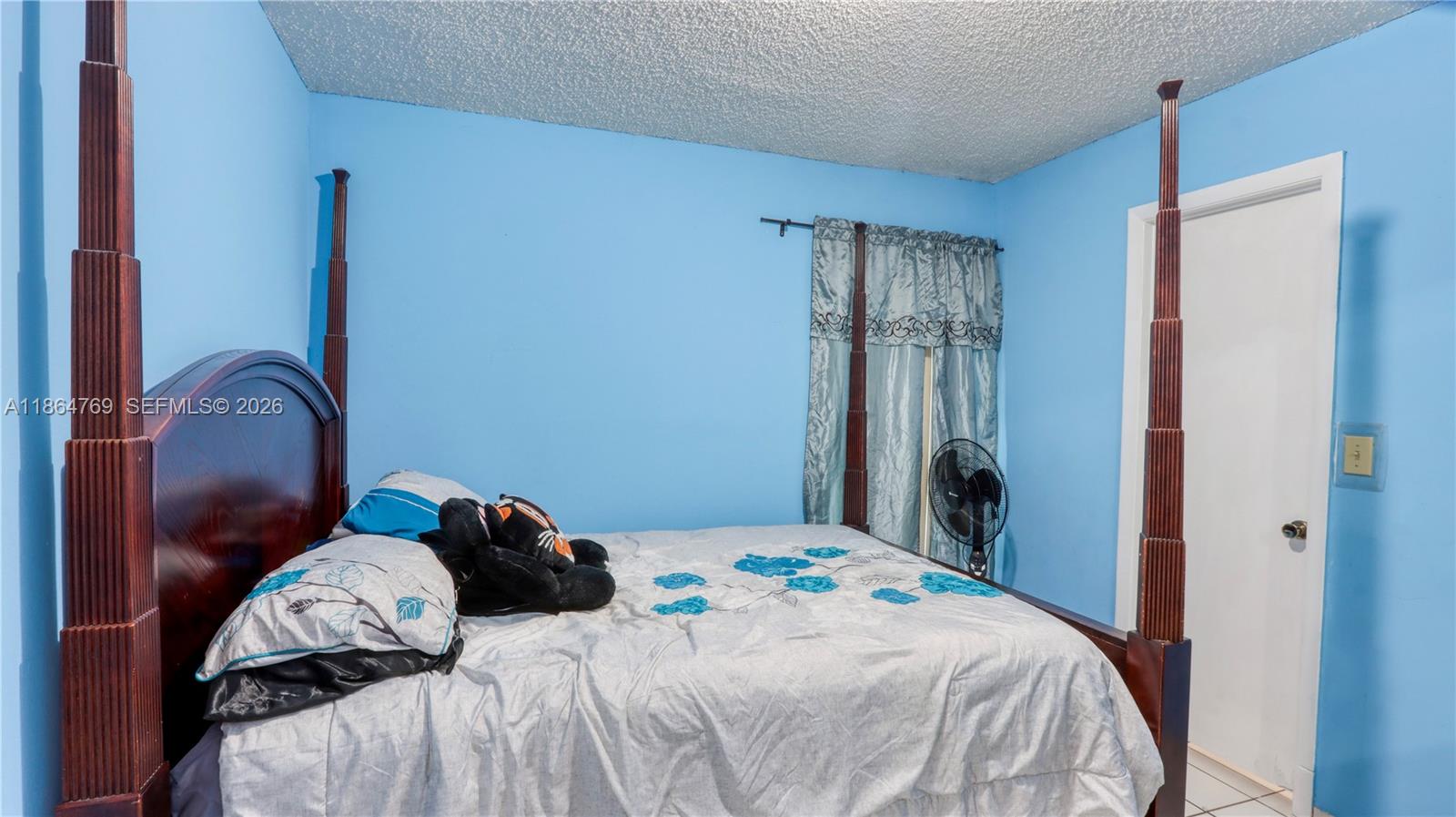 15825 Southwest 305th Terrace Homestead, FL 33033 - Photo 35 of 36 a bedroom with a bed and a window