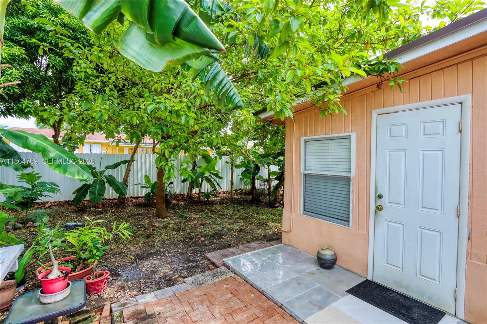 15825 Southwest 305th Terrace Homestead, FL 33033 - Photo 6 of 36 a backyard of a house with lots of green space