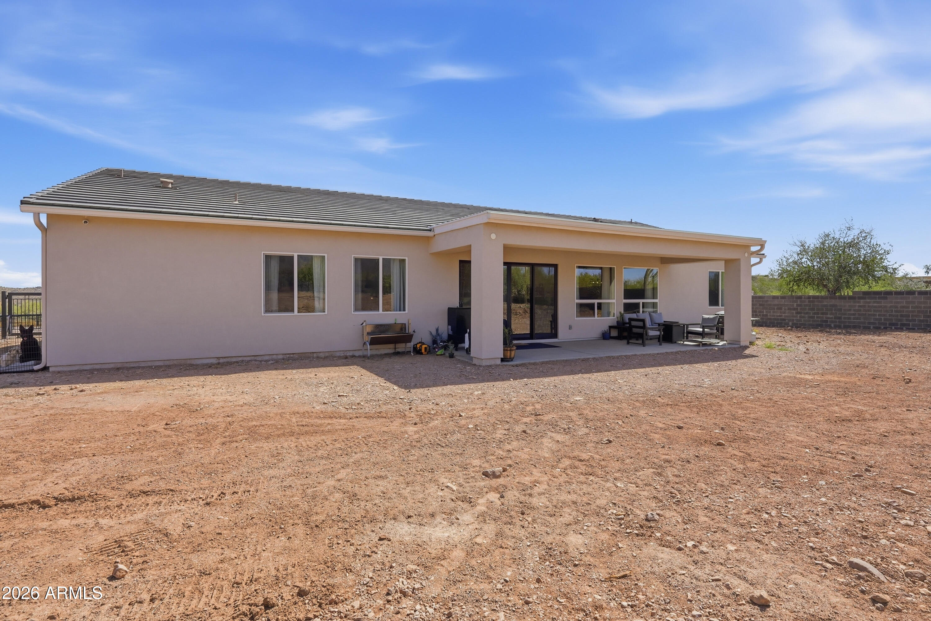 10464 East Magnolia Road Gold Canyon, AZ 85118 - Photo 53 of 77 a view of a house with backyard and porch