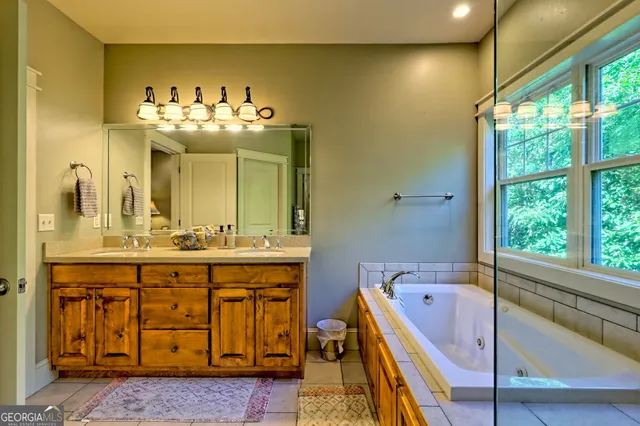 a bedroom with a bed and a mirror