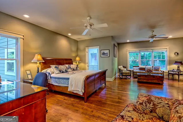 a bedroom with a bed and a painting