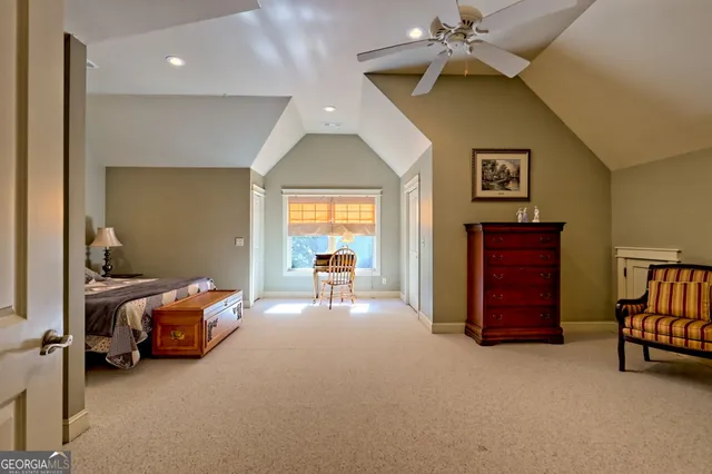a view of hallway with stairs and wooden floor