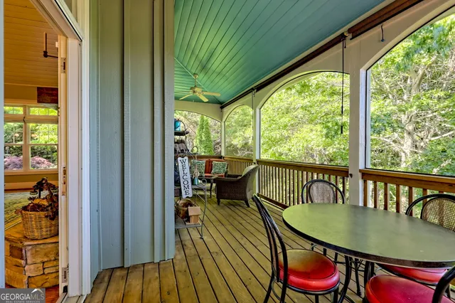a backyard of a house with lots of green space and fountain