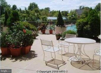 5505 Seminary Road, Unit 1407N Falls Church, VA 22041 - Photo 22 of 30 a view of a chairs and table in the patio