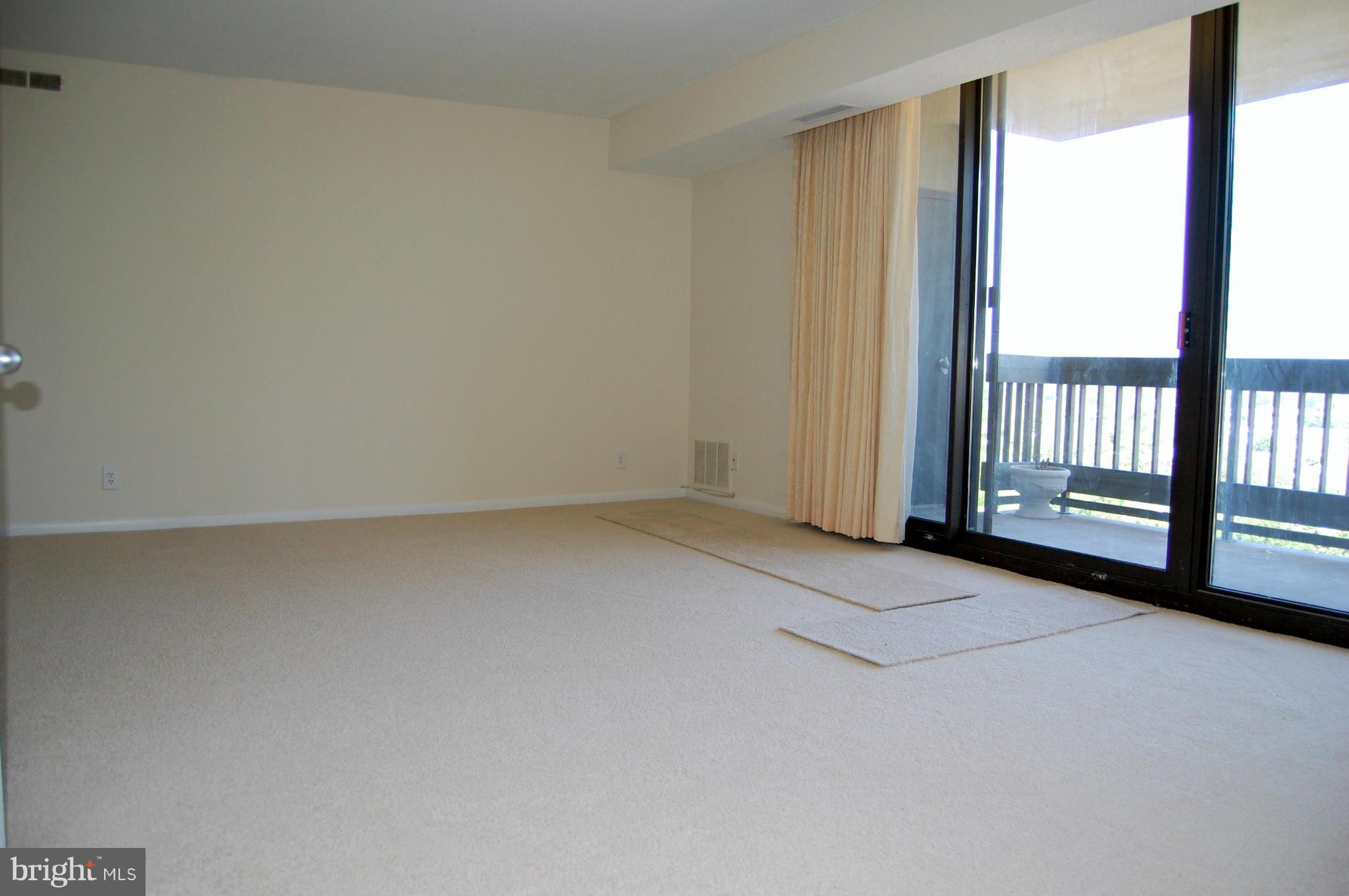 5505 Seminary Road, Unit 1407N Falls Church, VA 22041 - Photo 6 of 30 wooden floor in an empty room with a window
