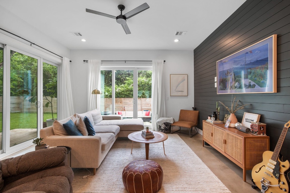 a living room with furniture and a large window