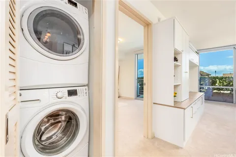 a view of a hallway with washer and dryer