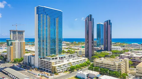 a view of balcony with two chairs and a potted plant