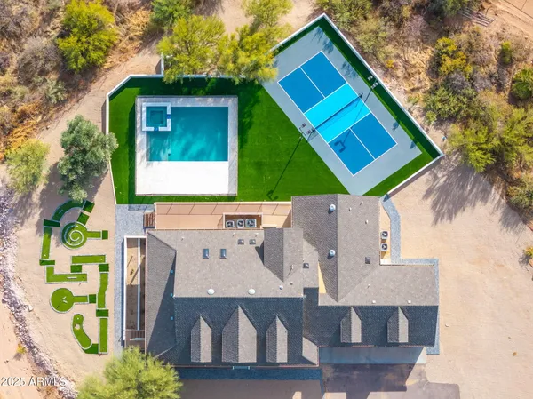 a view of a swimming pool with an outdoor space and seating area