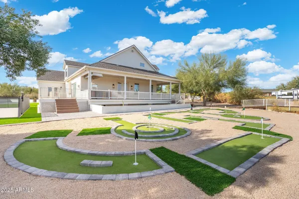 front view of a house with a lots of white walls