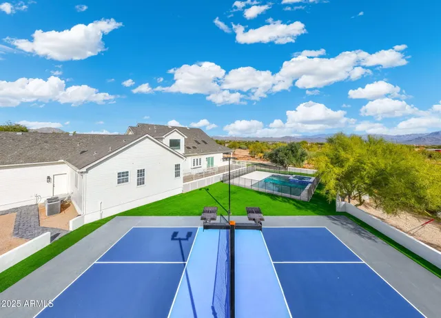 an aerial view of residential houses with outdoor space
