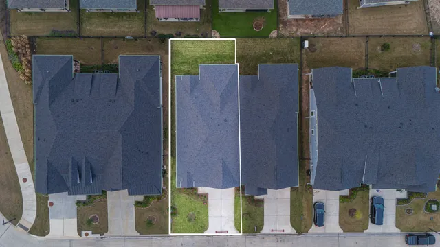 an aerial view of a house with street view