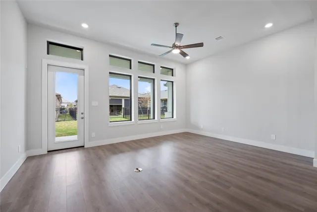 a view of kitchen with wooden floor and window