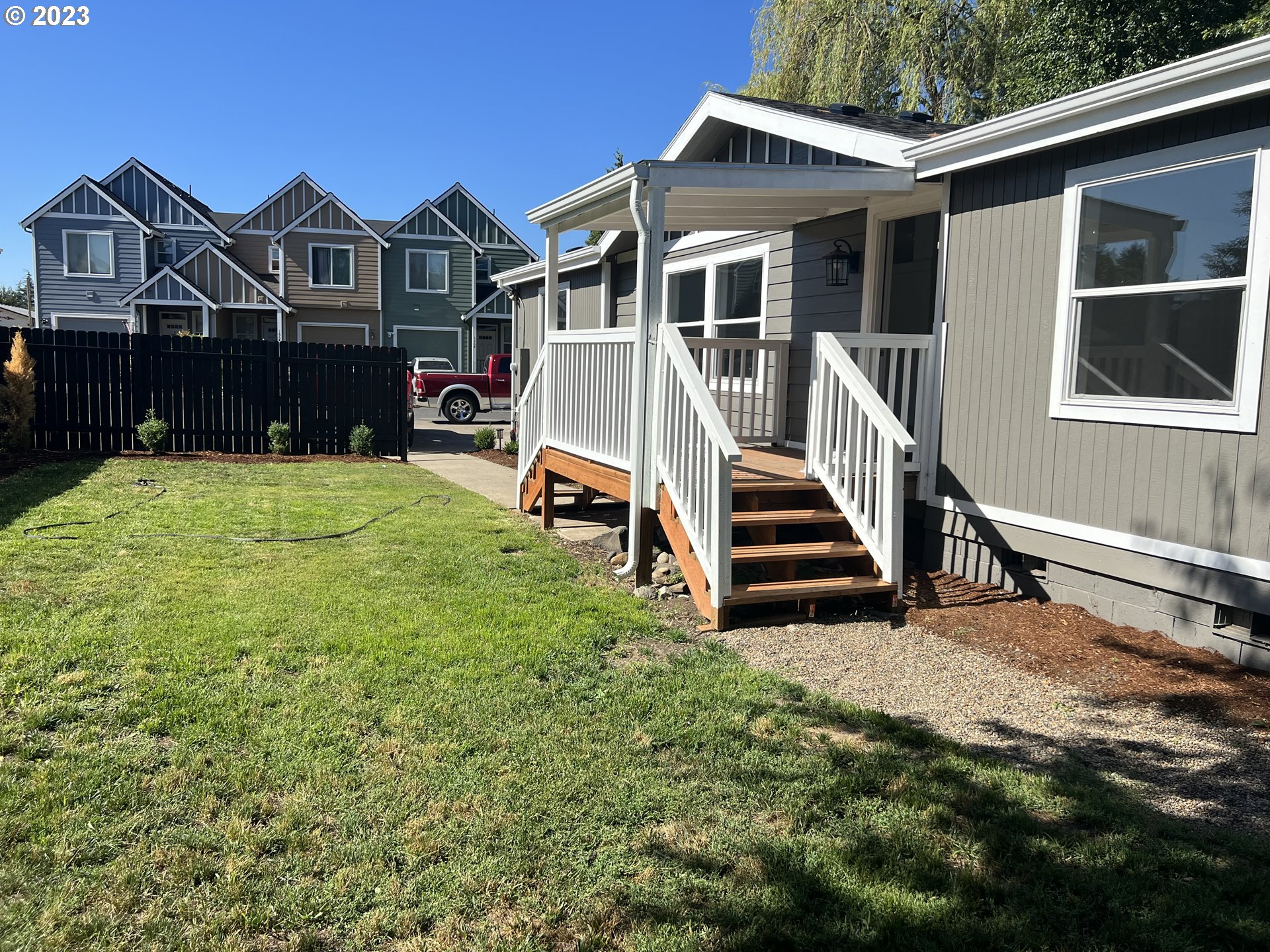 170 Fenton Avenue Molalla, OR 97038 - Photo 17 of 27 a view of a house with a yard and deck