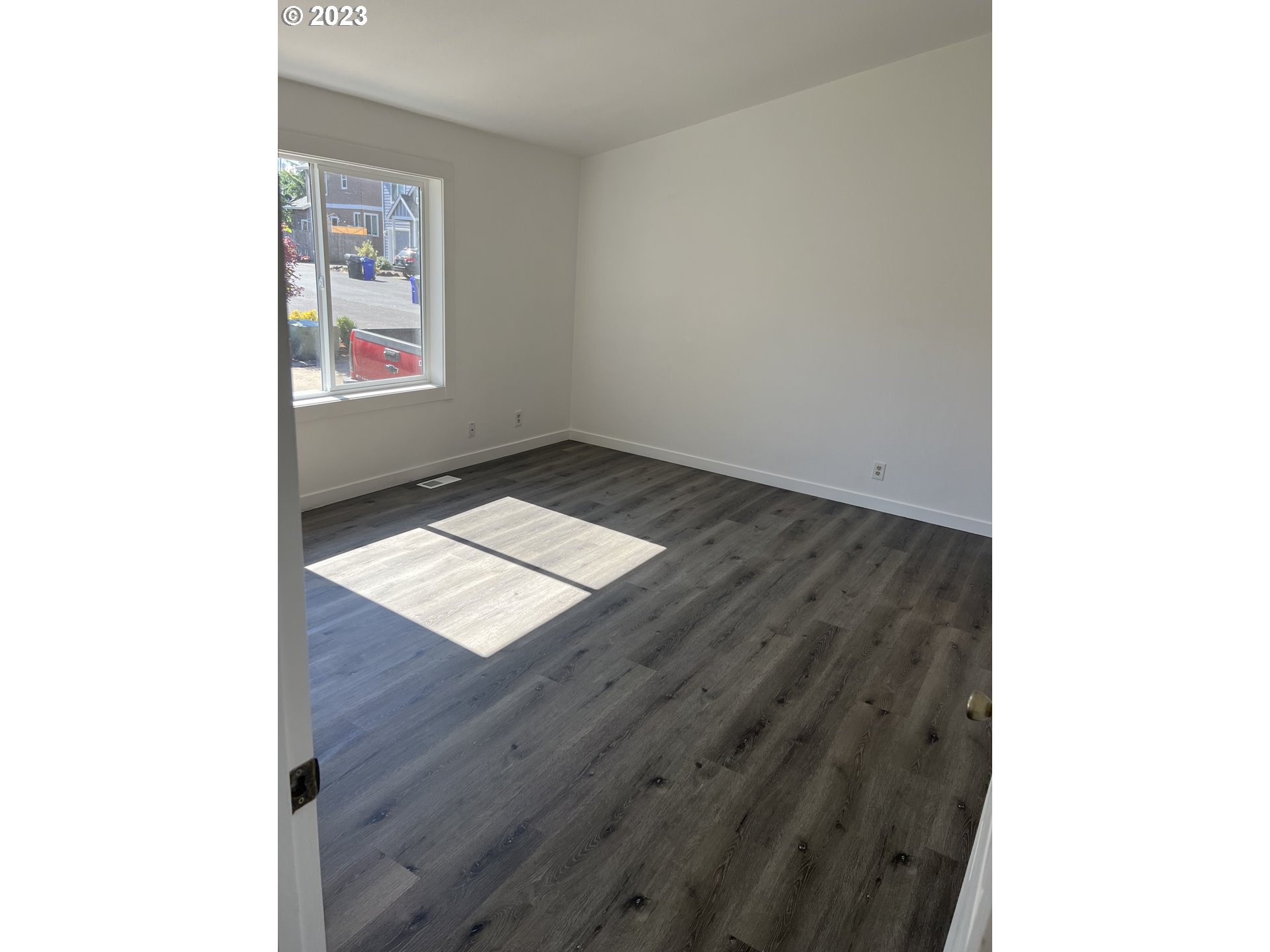 170 Fenton Avenue Molalla, OR 97038 - Photo 24 of 27 a view of an empty room with wooden floor and a window