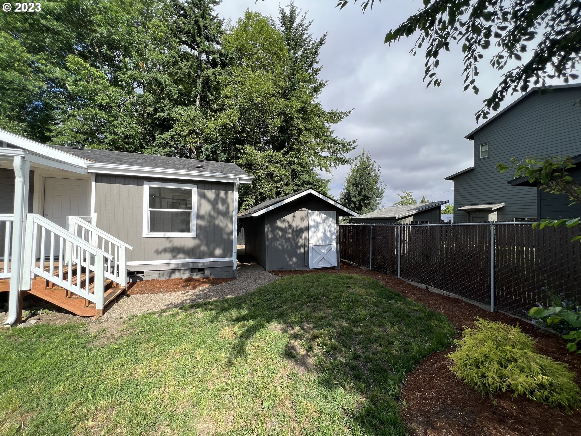170 Fenton Avenue Molalla, OR 97038 - Photo 4 of 27 a view of a house with a yard and fence