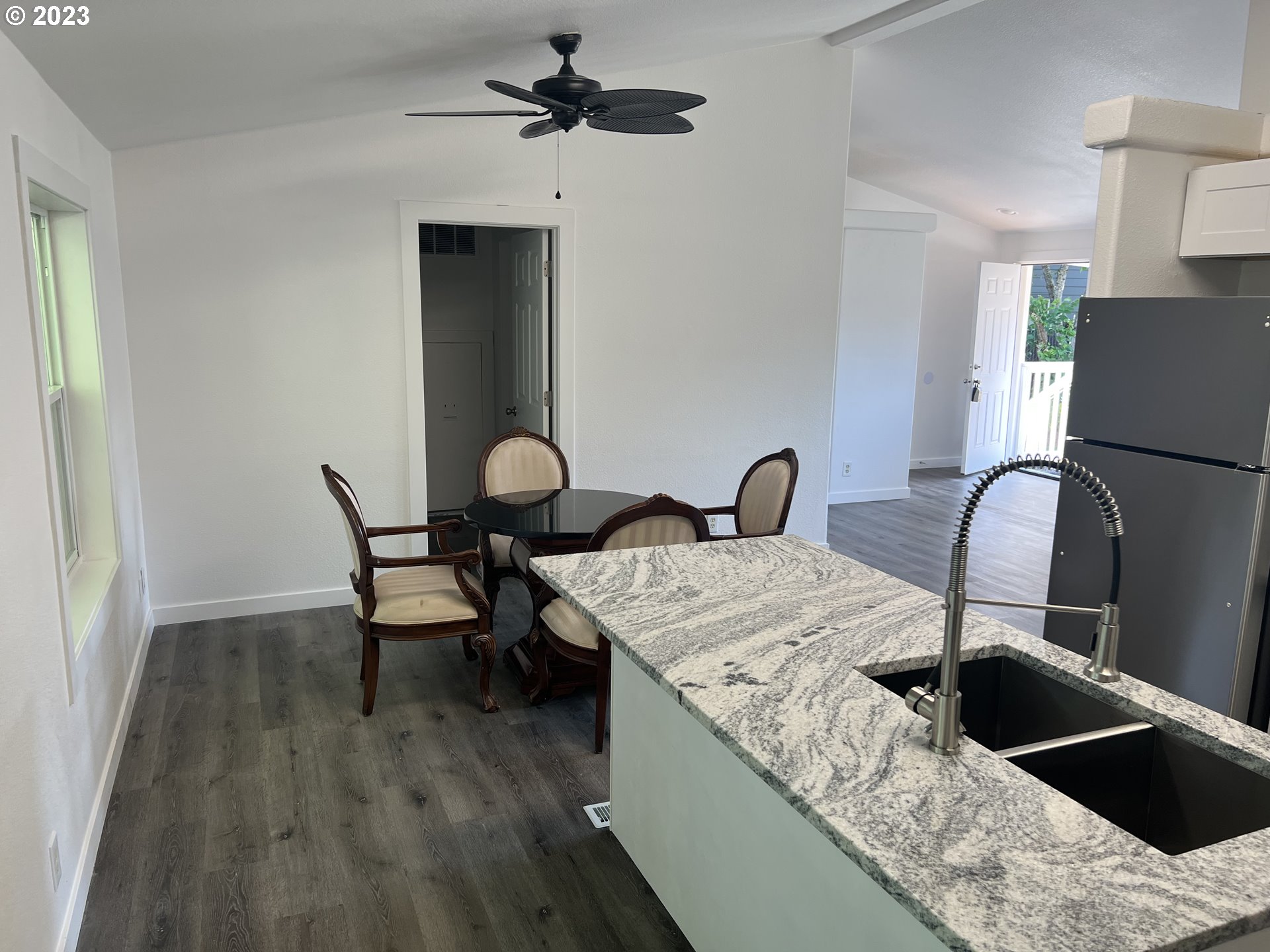 170 Fenton Avenue Molalla, OR 97038 - Photo 8 of 27 a kitchen with a table chairs and a wooden floor