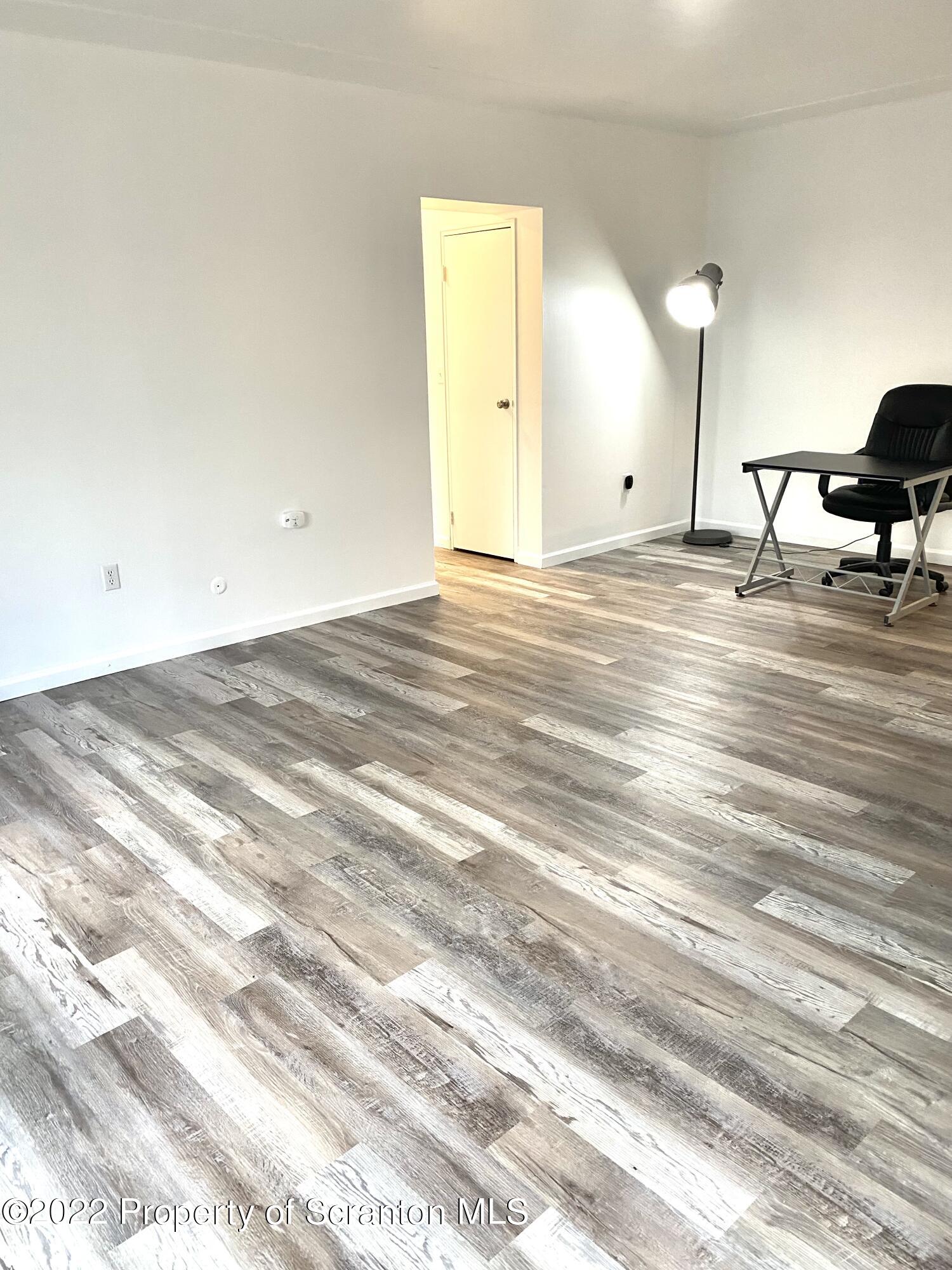 1111 Summit Pointe Scranton, PA 18508 - Photo 11 of 22 a view of a room with wooden floor