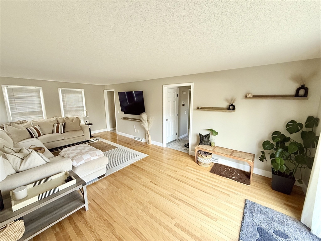 59 Chalmers Street Springfield, MA 01118 - Photo 12 of 22 a bedroom with furniture and a wooden floor