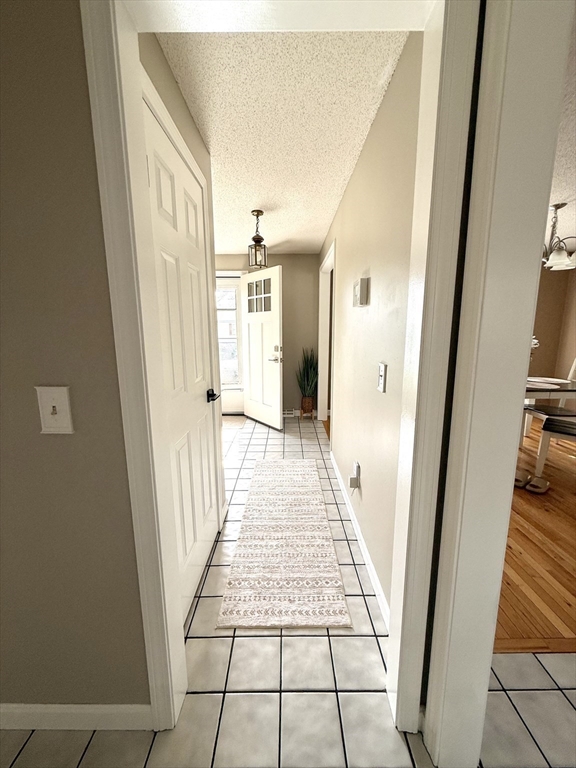 59 Chalmers Street Springfield, MA 01118 - Photo 8 of 22 a view of a hallway view with staircase