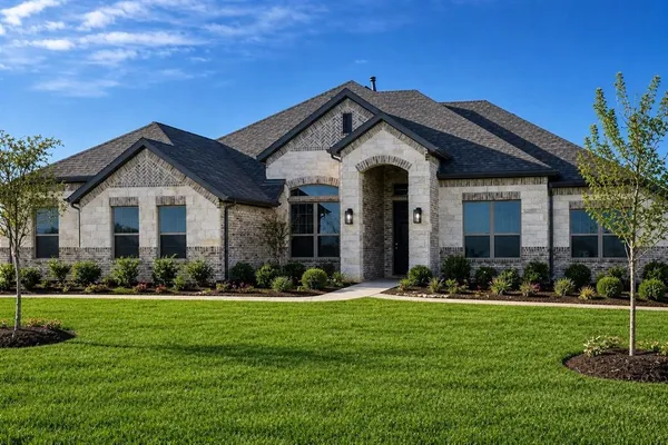 a front view of a house with a yard and porch