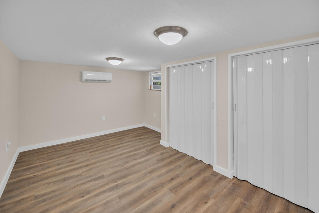 235 Antigua Road Tavernier, FL 33070 - Photo 12 of 48 a view of an empty room with wooden floor