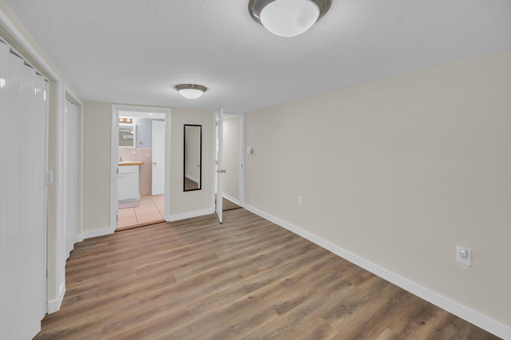 235 Antigua Road Tavernier, FL 33070 - Photo 14 of 48 a view of an empty room with wooden floor and a window
