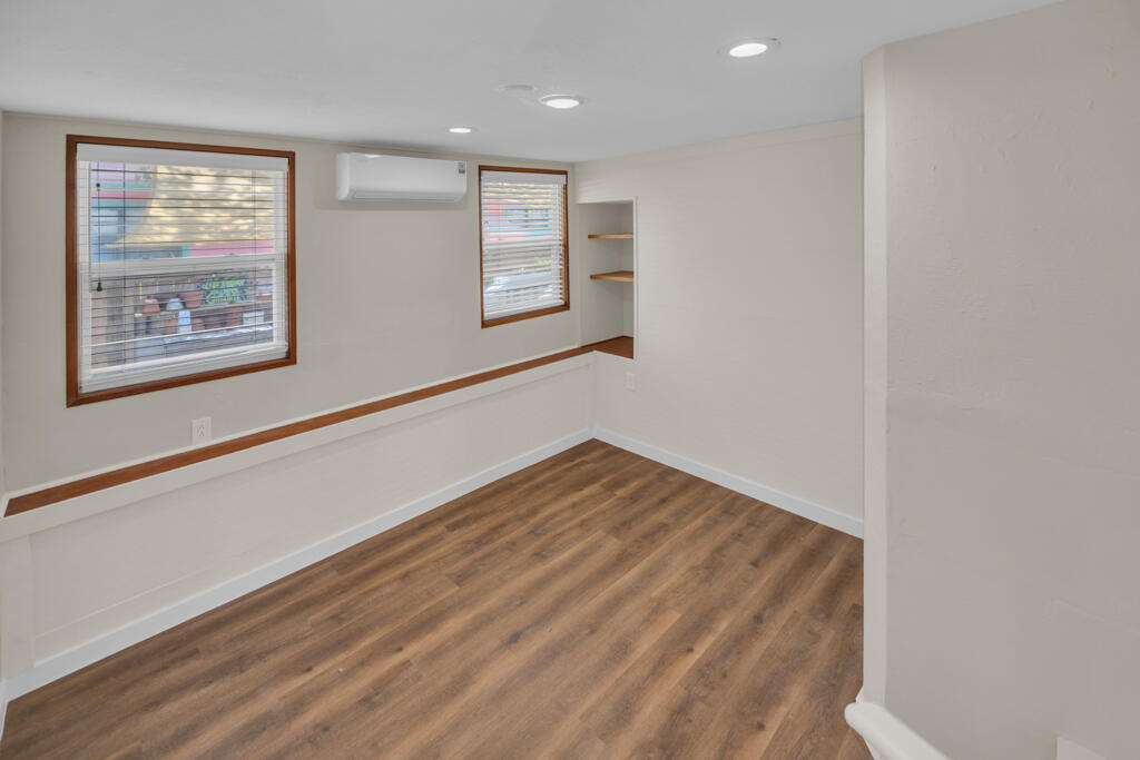 235 Antigua Road Tavernier, FL 33070 - Photo 16 of 48 a view of an empty room with window and wooden floor
