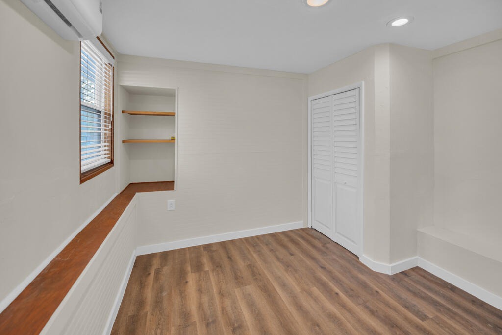 235 Antigua Road Tavernier, FL 33070 - Photo 17 of 48 wooden floor in an empty room with a window