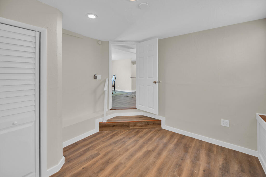235 Antigua Road Tavernier, FL 33070 - Photo 18 of 48 a view of a room with wooden floor and white walls