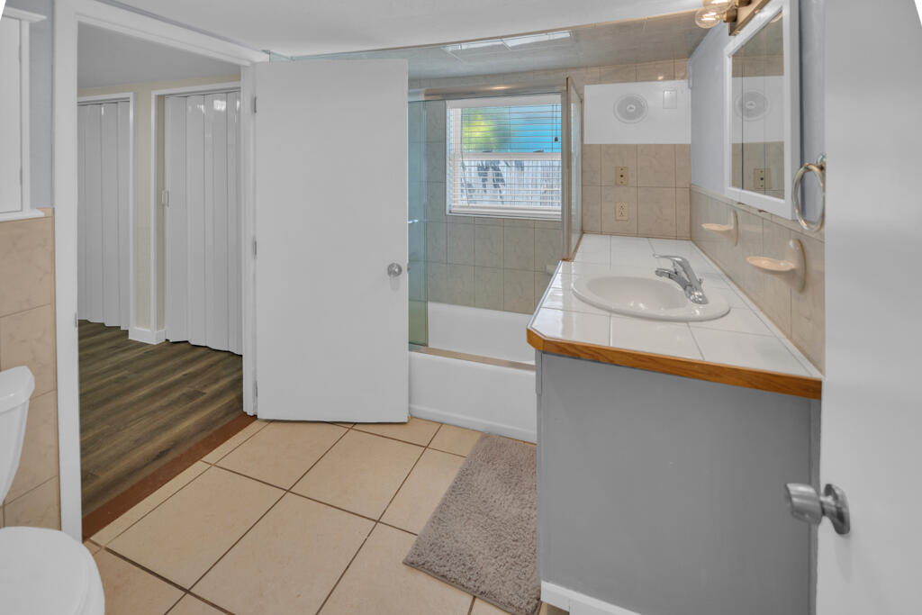 235 Antigua Road Tavernier, FL 33070 - Photo 19 of 48 a bathroom with a sink toilet and shower