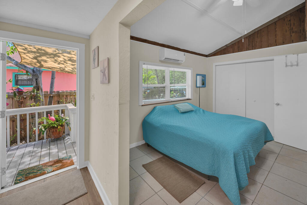 235 Antigua Road Tavernier, FL 33070 - Photo 22 of 48 a bedroom with a bed and a window