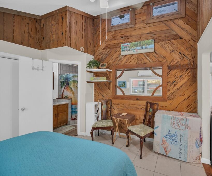 235 Antigua Road Tavernier, FL 33070 - Photo 24 of 48 a bedroom with a bed and a table in it