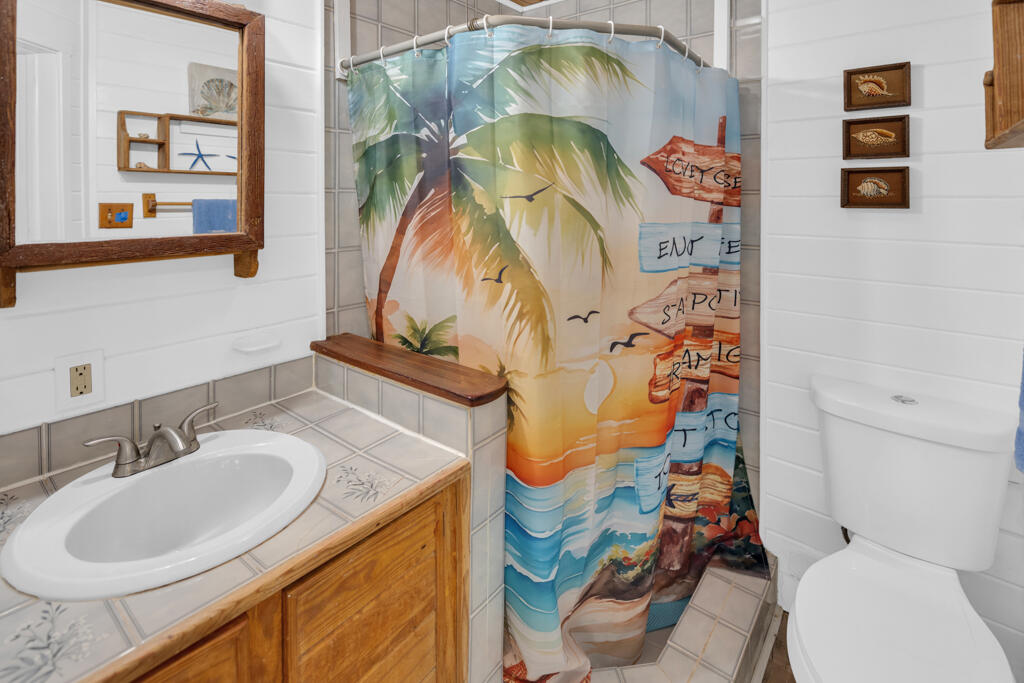 235 Antigua Road Tavernier, FL 33070 - Photo 25 of 48 a bathroom with a sink toilet and shower