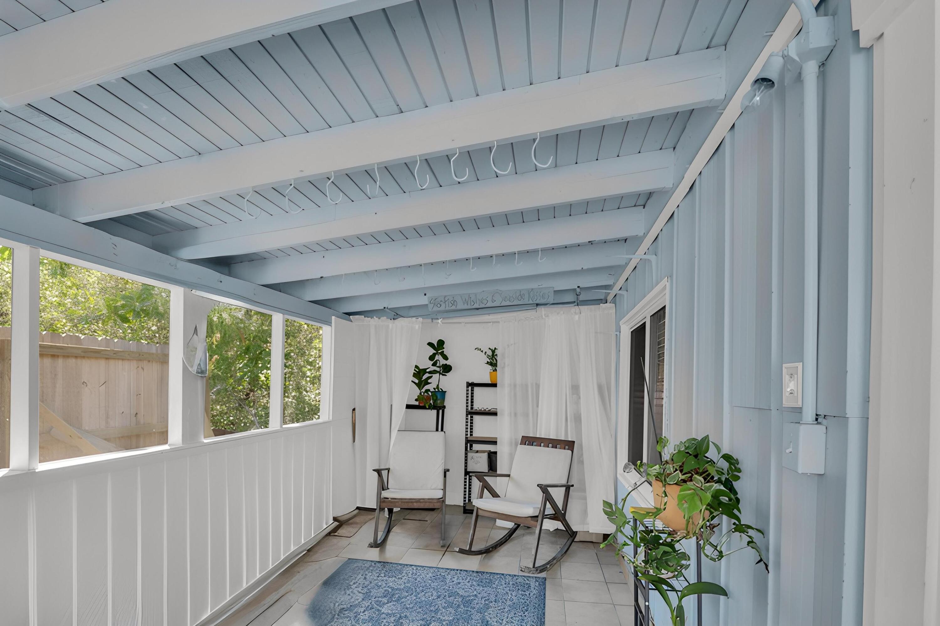 235 Antigua Road Tavernier, FL 33070 - Photo 28 of 48 a view of entryway with wooden floor and a potted plant
