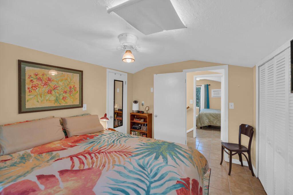 235 Antigua Road Tavernier, FL 33070 - Photo 37 of 48 a bedroom with a bed and a couch