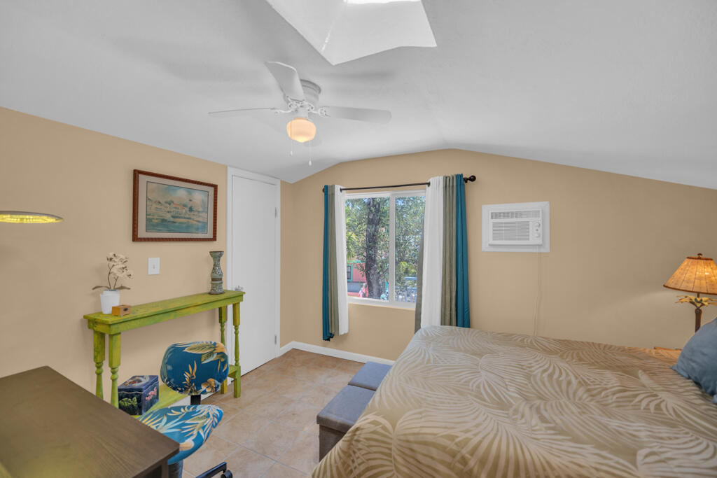 235 Antigua Road Tavernier, FL 33070 - Photo 40 of 48 a bedroom with a bed and a window