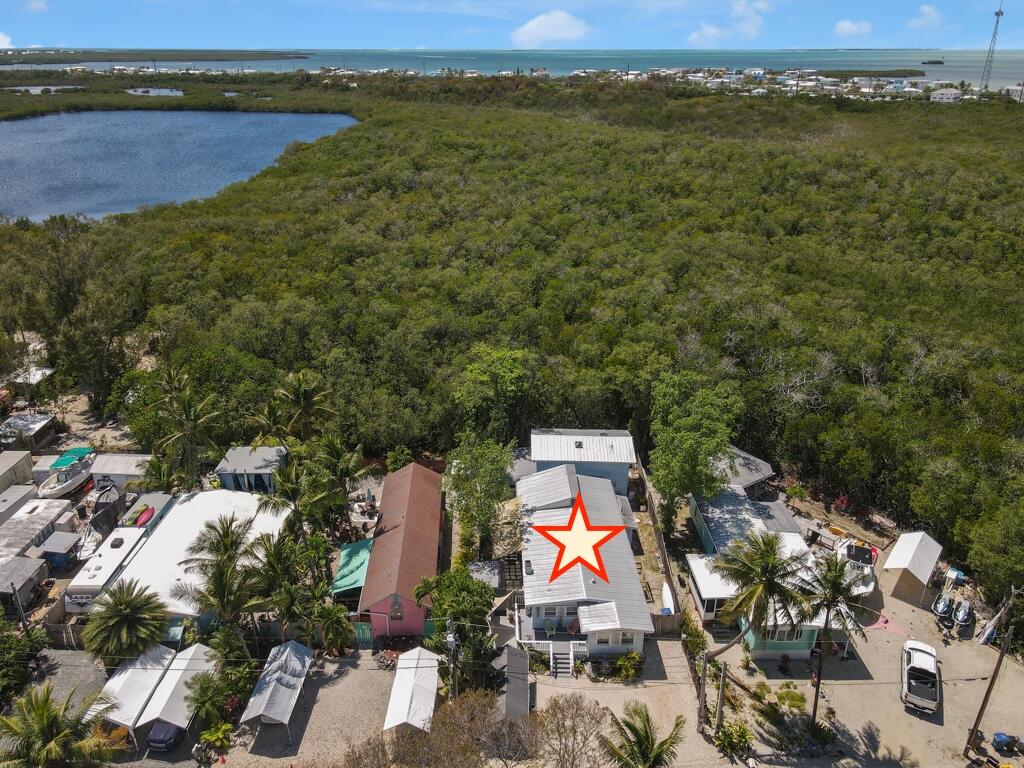 235 Antigua Road Tavernier, FL 33070 - Photo 44 of 48 an aerial view of residential houses with outdoor space and ocean view