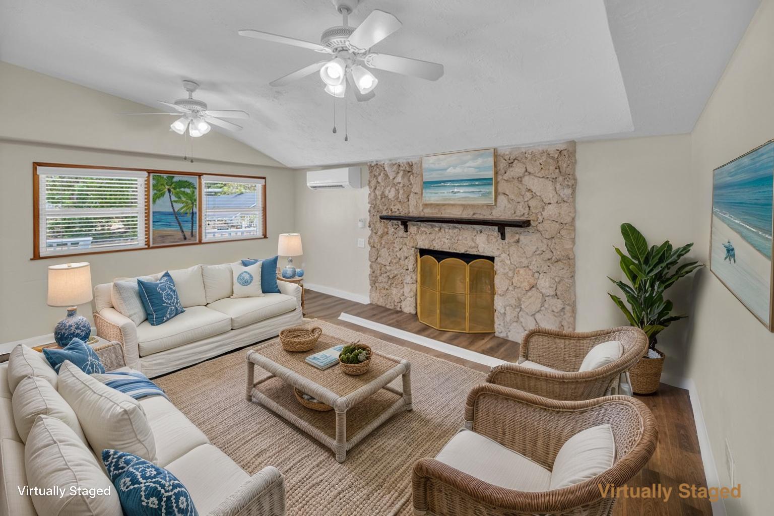235 Antigua Road Tavernier, FL 33070 - Photo 5 of 48 a living room with furniture a fireplace and a large window