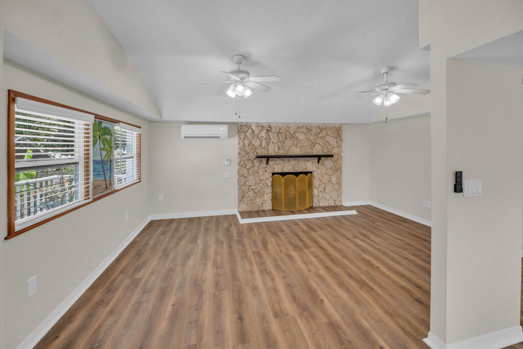 235 Antigua Road Tavernier, FL 33070 - Photo 7 of 48 wooden floor in an empty room with a window