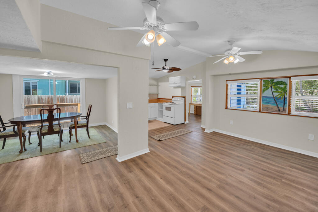 235 Antigua Road Tavernier, FL 33070 - Photo 9 of 48 a view of a livingroom with furniture a ceiling fan window and wooden floor