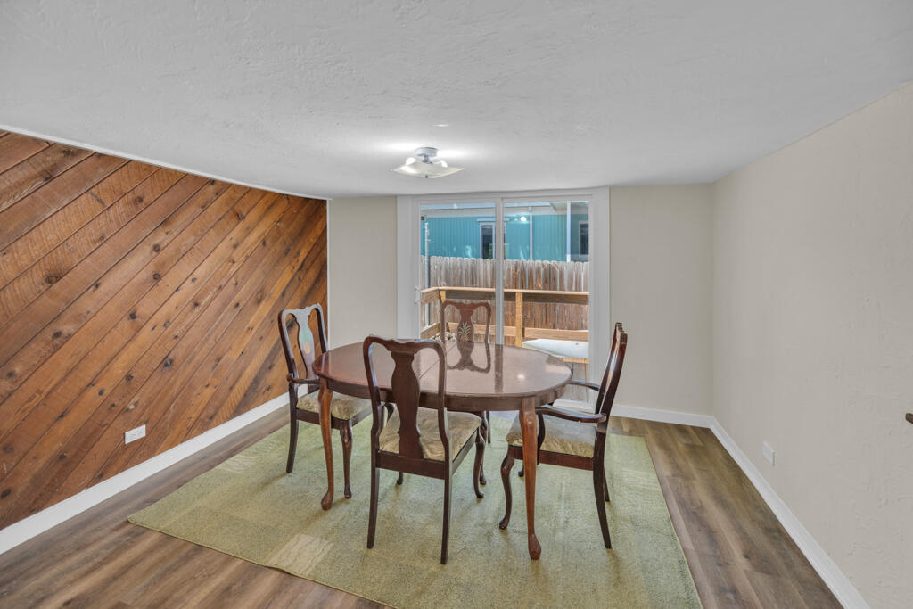235 Antigua Road Tavernier, FL 33070 - Photo 10 of 48 a view of a dining room with furniture and wooden floor